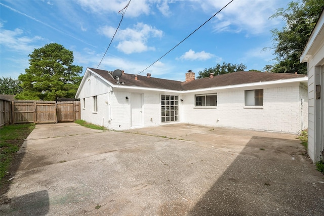 back of house featuring a patio