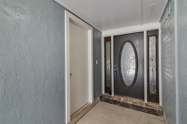 view of tiled foyer entrance