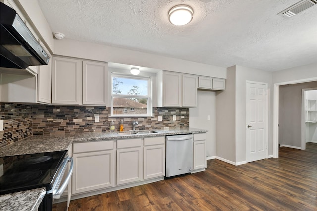 kitchen featuring light stone countertops, appliances with stainless steel finishes, ventilation hood, dark wood-type flooring, and sink