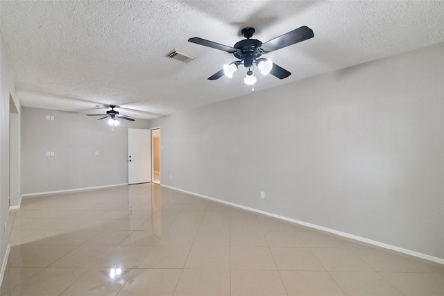 unfurnished room featuring a textured ceiling