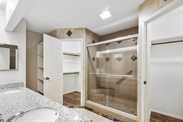 bathroom with vanity and a shower with shower door