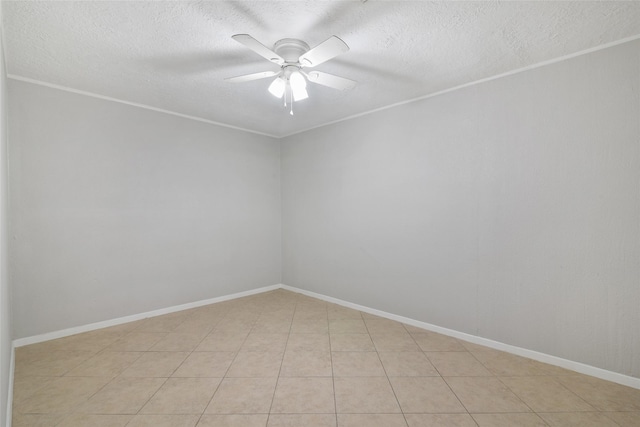 unfurnished room featuring ceiling fan and light tile patterned floors