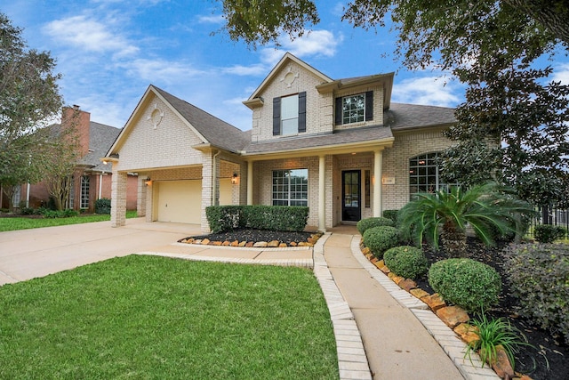 view of front of house with a front yard and a garage