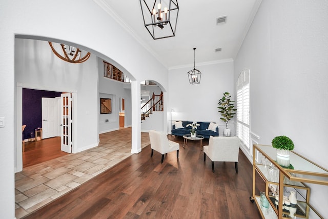 entrance foyer featuring hardwood / wood-style flooring and crown molding