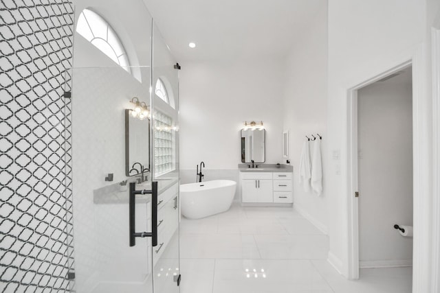 bathroom featuring tile patterned floors, vanity, and separate shower and tub