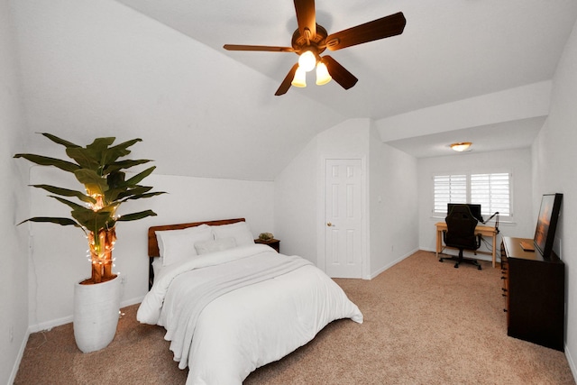 bedroom featuring ceiling fan, light carpet, and vaulted ceiling