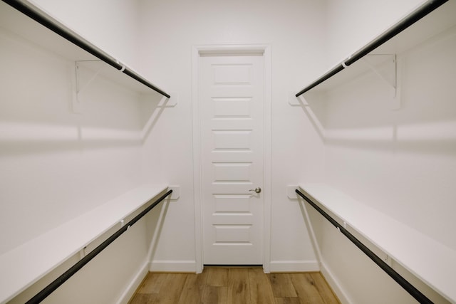 spacious closet featuring light wood-style floors