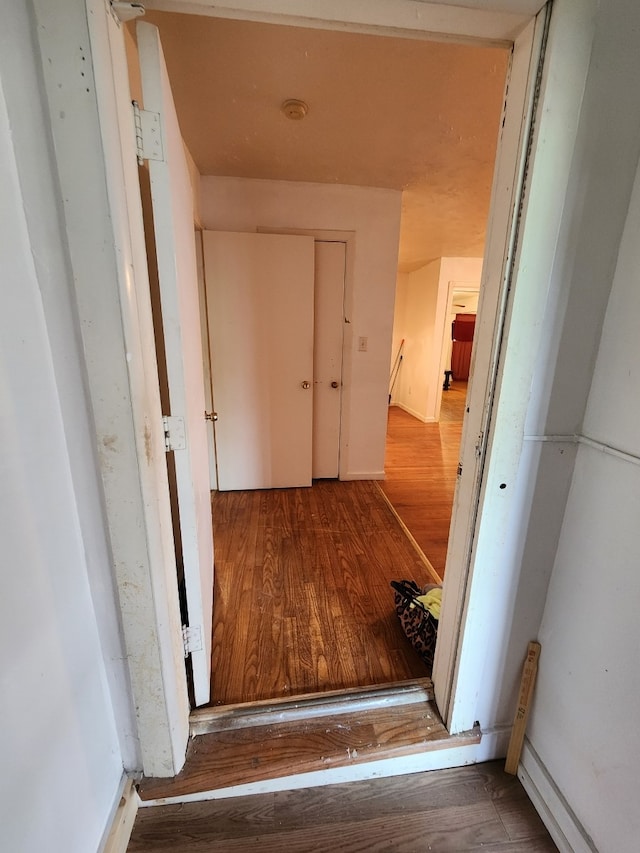 hallway featuring hardwood / wood-style flooring