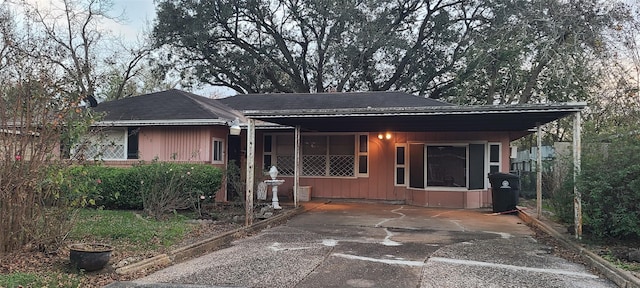 view of front facade with a carport