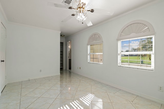 spare room featuring ceiling fan and ornamental molding