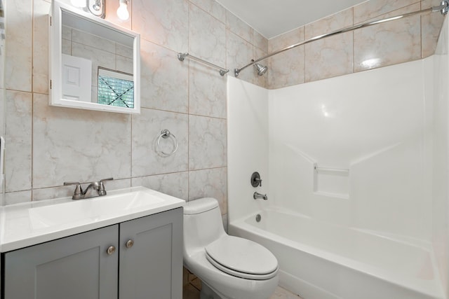 full bathroom with backsplash, vanity, shower / washtub combination, tile walls, and toilet