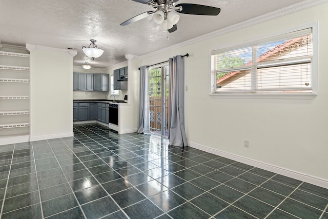 kitchen with white range oven, gray cabinetry, a textured ceiling, and ornamental molding