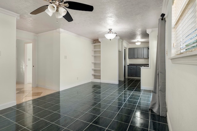 unfurnished living room featuring ceiling fan, a textured ceiling, and ornamental molding