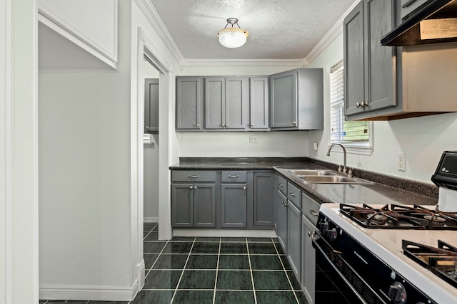 kitchen with ornamental molding, gray cabinetry, white range with gas cooktop, sink, and range hood