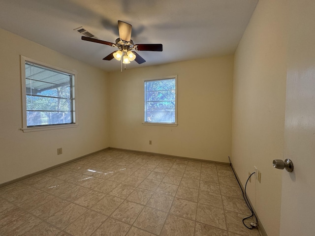 spare room with ceiling fan