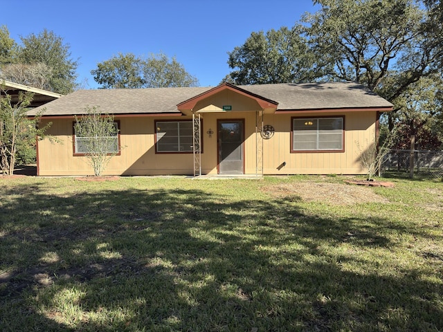 ranch-style home featuring a front yard