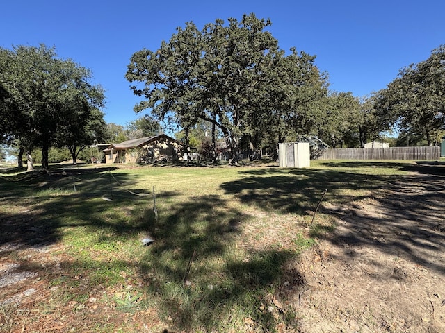 view of yard with a storage unit