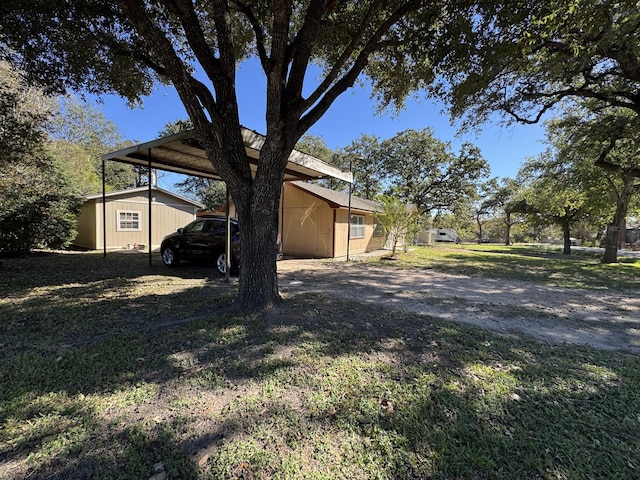 exterior space featuring a shed and a carport