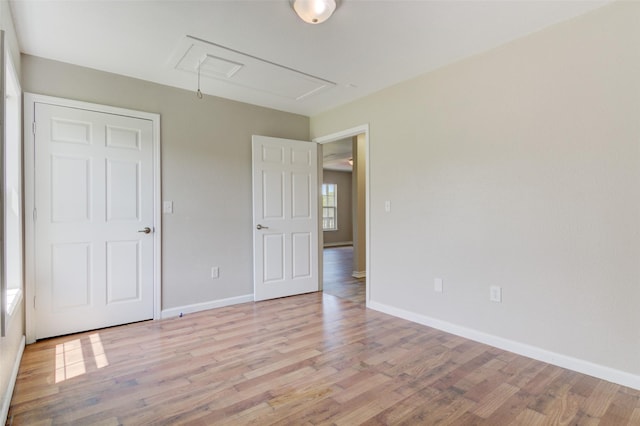 unfurnished bedroom with light wood-type flooring