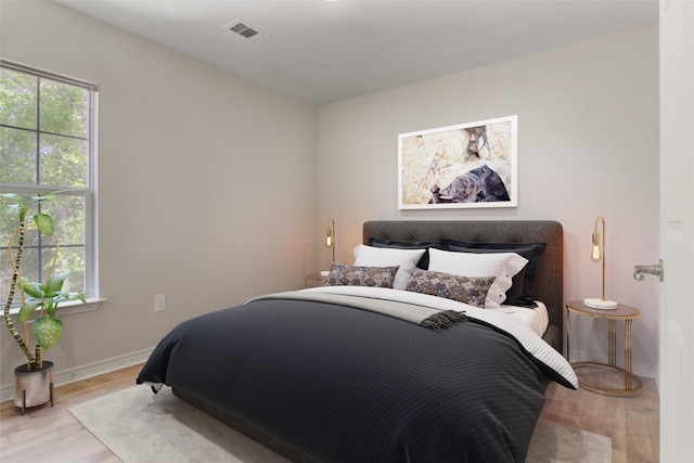 bedroom with light hardwood / wood-style flooring