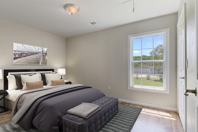 bedroom with light hardwood / wood-style floors