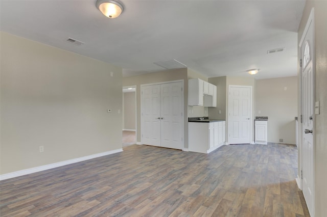 unfurnished living room with hardwood / wood-style floors