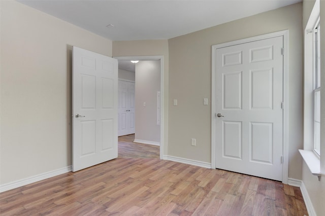 unfurnished bedroom with light hardwood / wood-style floors