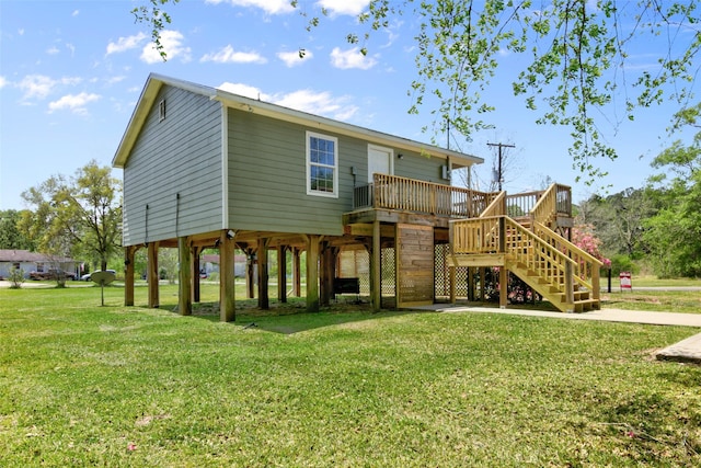 back of house with a lawn and a wooden deck