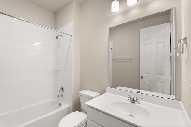 full bathroom featuring vanity, bathtub / shower combination, and toilet