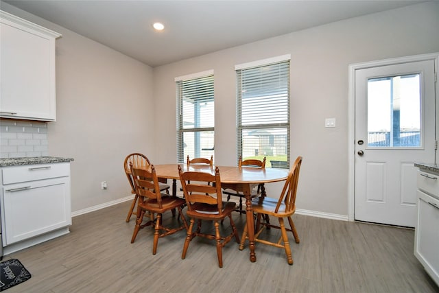 dining space featuring light wood-type flooring