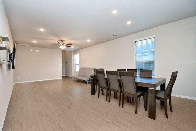 dining area featuring light hardwood / wood-style floors and ceiling fan