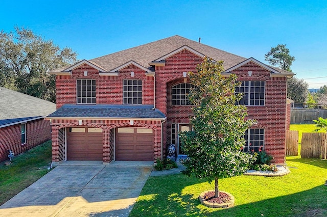 front of property featuring a front yard and a garage