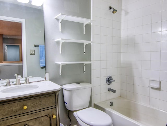 full bathroom featuring vanity, toilet, and tiled shower / bath