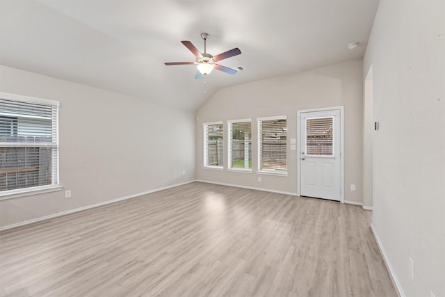 spare room featuring ceiling fan, light hardwood / wood-style flooring, and lofted ceiling