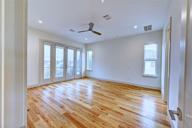 unfurnished room featuring ceiling fan and light hardwood / wood-style flooring