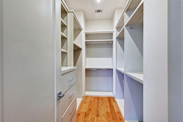 walk in closet featuring light wood-type flooring