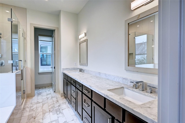 bathroom with vanity and a shower with shower door