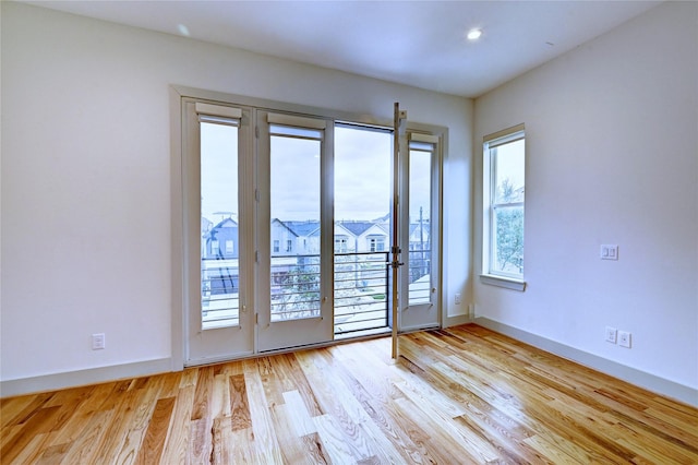 doorway to outside with light wood-type flooring