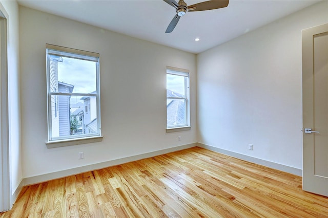 empty room with light hardwood / wood-style flooring and ceiling fan