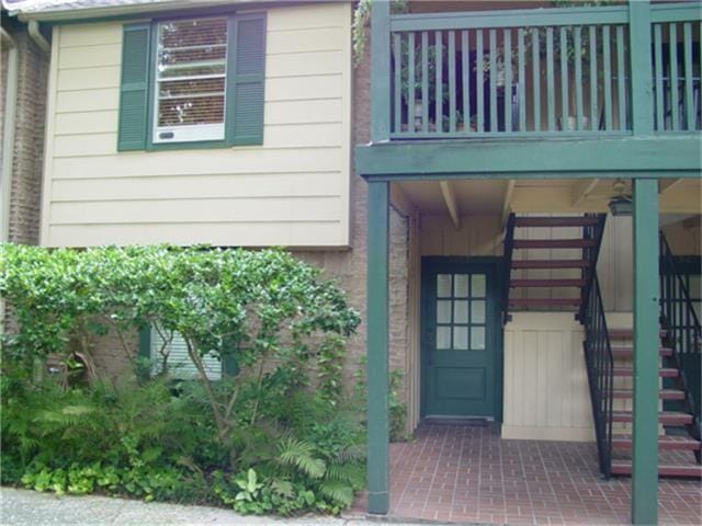 doorway to property featuring a balcony