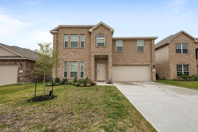 view of front property featuring a garage and a front lawn