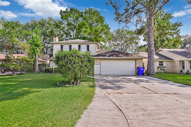 view of front of home featuring a front yard and a garage