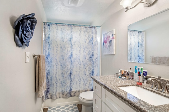 full bathroom featuring a textured ceiling, vanity, toilet, and shower / tub combo with curtain