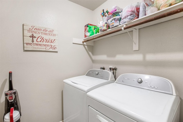 washroom with washing machine and clothes dryer