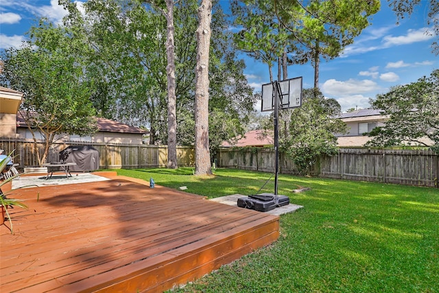 wooden terrace with a yard