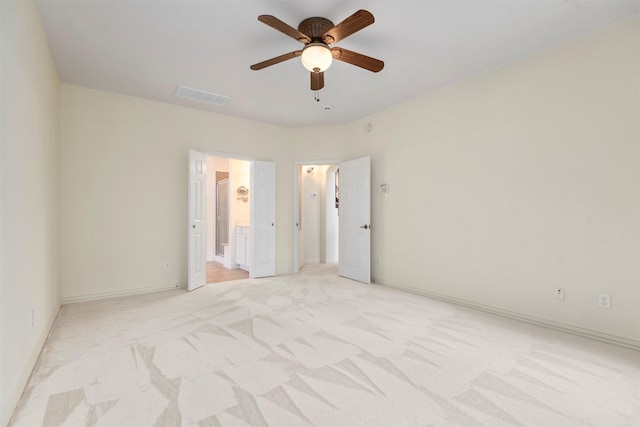 unfurnished room featuring ceiling fan and light carpet