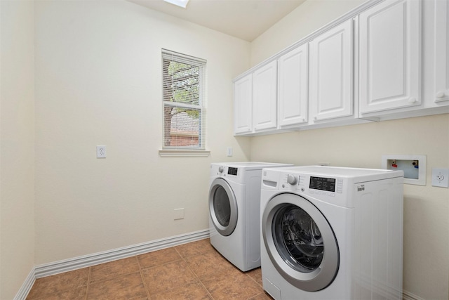 laundry room featuring cabinets, independent washer and dryer, and light tile patterned floors