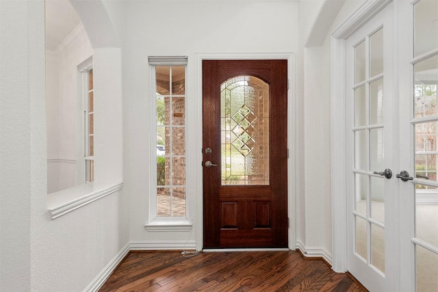 foyer entrance featuring french doors and dark wood-type flooring