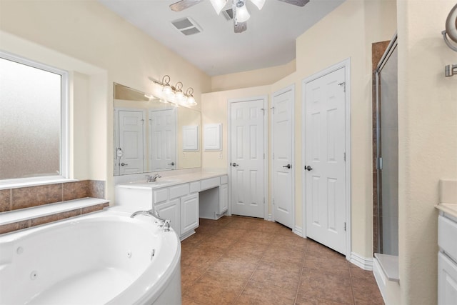 bathroom with vanity, ceiling fan, and plus walk in shower