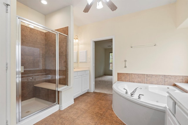 bathroom featuring tile patterned flooring, vanity, ceiling fan, and independent shower and bath